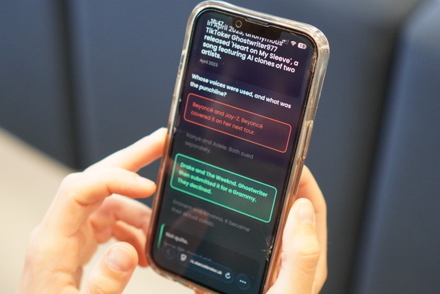 A workshop attendee playing the AI Gone Wrong quiz on their phone